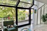 Einzigartiges Architektenhaus - Markante Doppelhaushälfte mit schönem Garten