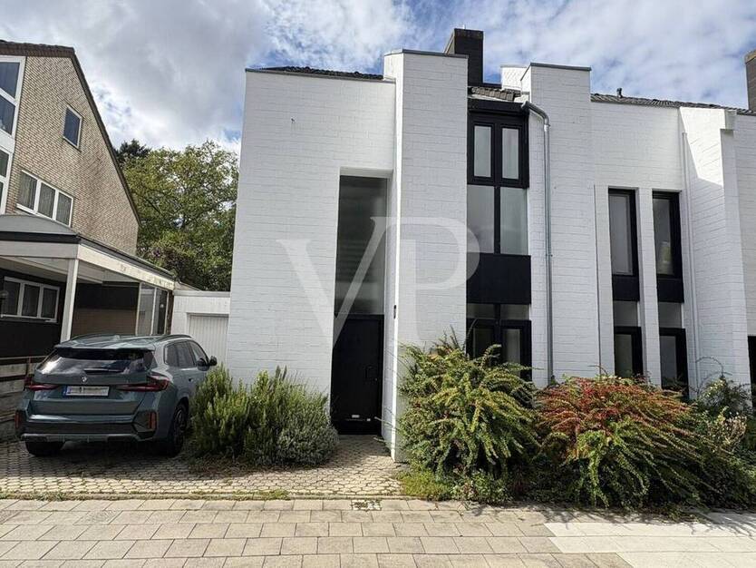 Einzigartiges Architektenhaus - Markante Doppelhaushälfte mit schönem Garten