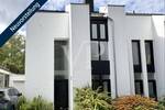 Einzigartiges Architektenhaus - Markante Doppelhaushälfte mit schönem Garten